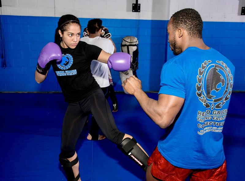 Adult MMA Striking class training on the pads at Renzo Gracie Jiu Jitsu Academy Milford, CT