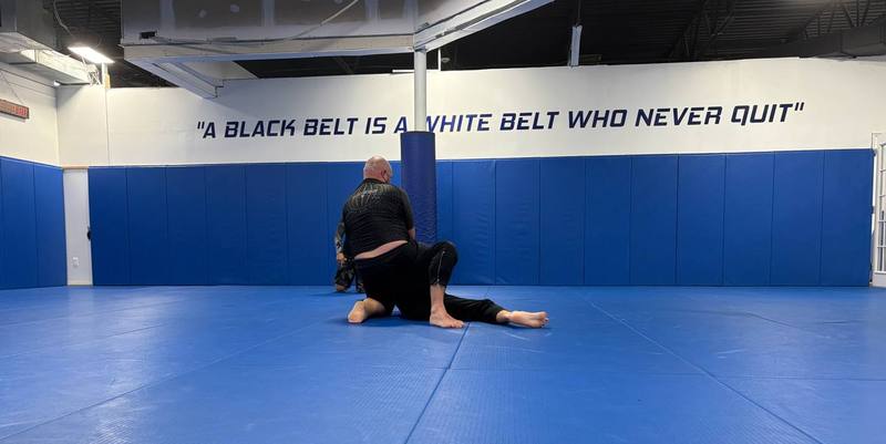 The training mat and academy wall at Renzo Gracie Milford
